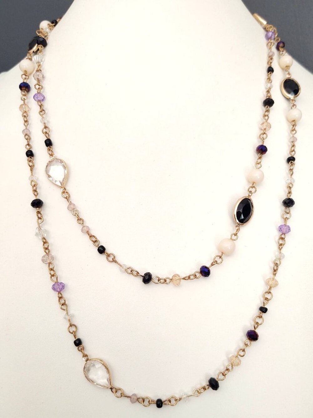 Single strand black, white, purple beaded necklace